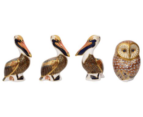 A group of four First Edition Royal Crown Derby paperweightsincluding three of Brown Pelicans and an Owl, all decorated in ty