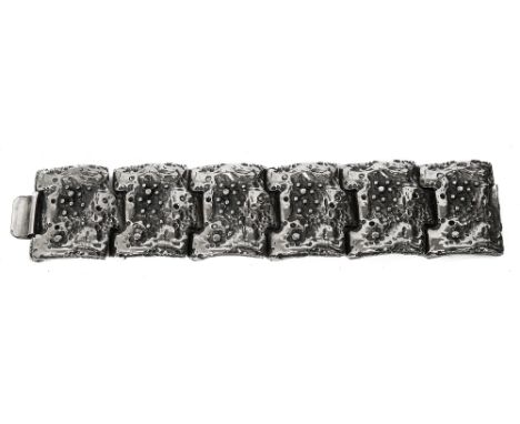 Robert Larin. A 1970s Brutalist textured silver plated pewter panel braceletstamped R Larin formed of six curved panels with 