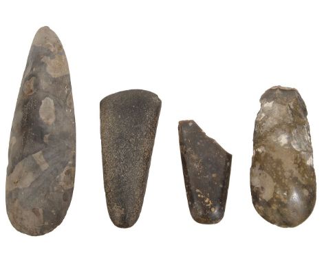 Four Neolithic polished flint and stone axe heads, (4)Largest 25cm.Condition:Smallest is broken and missing a section 