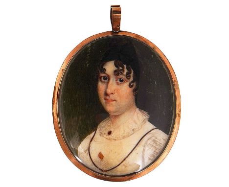 Early 19th century School. A portrait miniature of a young ladyoval,  watercolour on ivory, gilt glazed metal frame, the lock