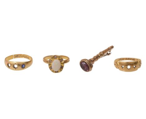 A Victorian 18ct yellow  gold gypsy ring, stamped with Birmingham hallmark, set with one sapphire, together with another 18ct