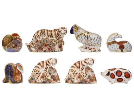 A collection of eight Royal Crown Derby paperweights including a Bengal Tiger, a pair of Bengal Tiger Cubs, a Ram, a Horse, a