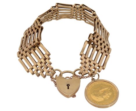 A 9ct gold six bar gate bracelet marked '9.375', with heart padlock marked '9.375' and safety chain, suspending 1915 sovereig