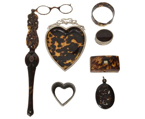 A group of six tortoiseshell pieces and an Indian Kutch silver pin cushionlate 19th/early 20th centurythe first a heart form 