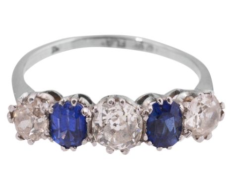 A  diamond and sapphire five stone ring, set with three old brilliant-cut diamonds separated by a cushion-shaped sapphire, th