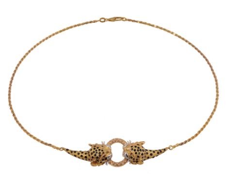 A double leopard's head chain necklace, each of the leopards with black enamelled dot decoration with ruby and diamond detail