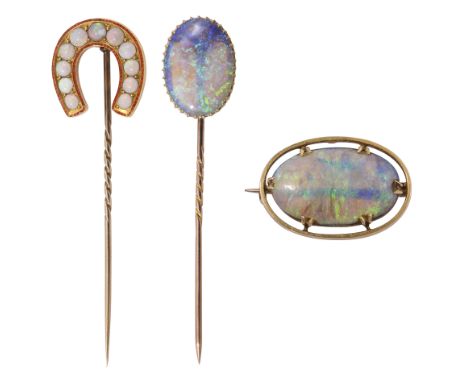 Three items of Victorian/Edwardian opal and yellow gold jewellery: the first yellow gold everted horseshoe stick pin set with