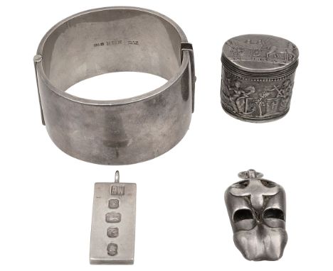 A late 19th century Dutch .800 silver cachou box, an Art nouveau double whistle, a hinged cuff bangle and an ingot pendant fi