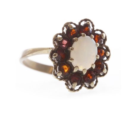 NINE CARAT GOLD OPAL AND GARNET CLUSTER RINGset with a single oval opal surrounded by round garnets, size P-Q, 4g