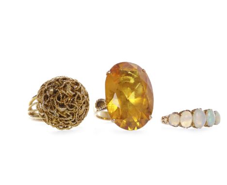 MID TWENTIETH CENTURY CITRINE DRESS RINGset with a single large oval citrine 24x17mm in an ornate ropework setting, in eighte