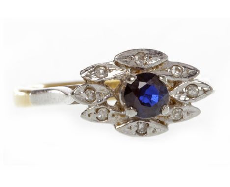 EIGHTEEN CARAT GOLD DIAMOND AND SAPPHIRE DRESS RINGthe navette shaped bezel set with a central sapphire of approximately 0.25