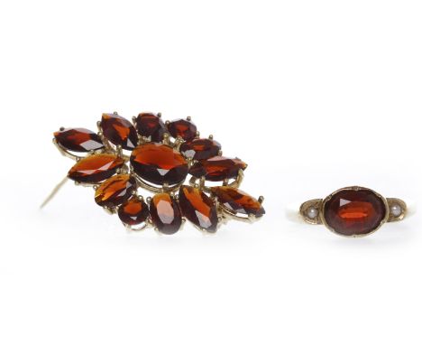 NINE CARAT GOLD GARNET SET BROOCHof rhombic form and set with oval and marquise shaped garnets, 32mm long, 3.9g; along with a