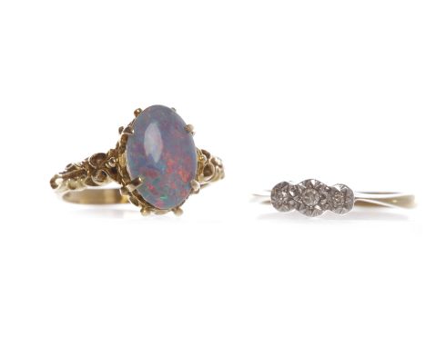 NINE CARAT GOLD OPAL SIMULANT DRESS RINGsize N, 3.9g; along with a diamond three stone ring in nine carat gold, size O, 2.2g 