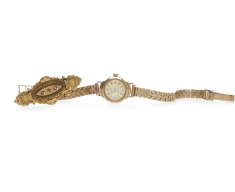 LADY'S UNO NINE CARAT GOLD MANUAL WIND COCKTAIL WATCHthe round dial with applied gold coloured baton hour markers, on a nine 