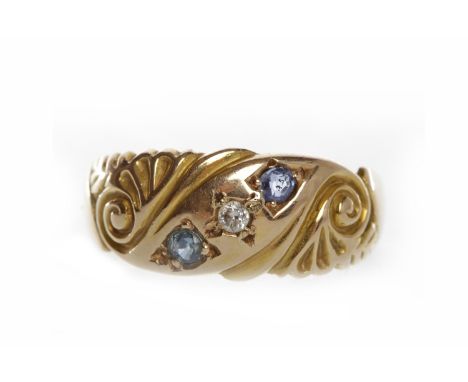 VICTORIAN FIFTEEN CARAT GOLD DIAMOND AND GEM SET RINGin the form of a tapered band and set with a central round diamond flank