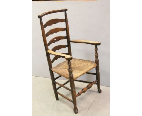 19th century Provincial North Country Macclesfield Ladder Back Elbow Chair with Rush Seat