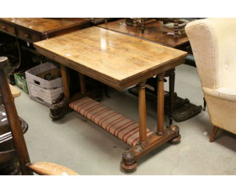 Victorian Rosewood Table raised on Double Turned Supports with Sledge Bases on Castors united by an upholstered stretcher, 10