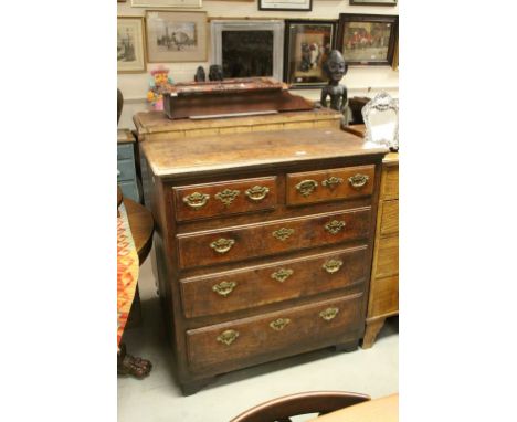 18th century Oak Chest of Two Short over Three Long Drawers with replaced brass swan neck handles and escutcheon raised on cu
