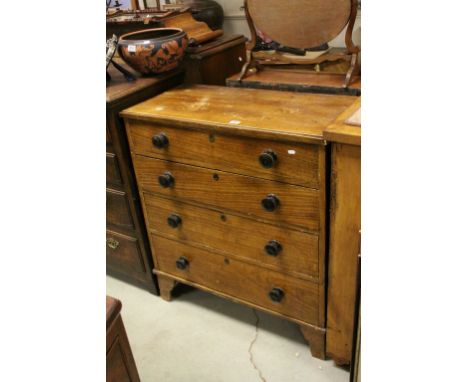 Victorian Pine Chest of Four Long Drawers with Turned Wooden Handles and raised on bracket feet, 91cms wide x 101cms high
