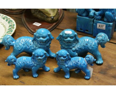 Two Pairs of Chinese Turquoise Blue Glazed Ceramic Standing Dogs of Foe, 14cms high and 11cms high