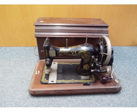 A decorative vintage Bradbury's Family V.S hand cranked sewing machine in wooden case Est £20 - £30 This lot MUST be paid for