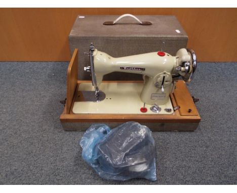 A vintage Brother Deluxe sewing machine in case This lot MUST be paid for and collected, or delivery arranged, no later than 