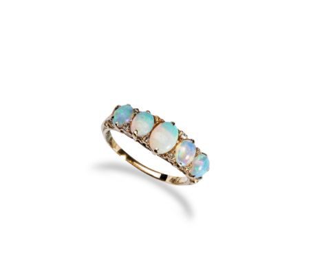 A FIVE STONE OPAL RING, CIRCA 1900 set with five oval opal cabochons graduating in size with diamond chip accents, one missin