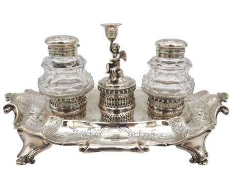 AN ELEGANT SILVER INK STAND, profuse chased foliate decoration with scroll edge, raised on four scrolling bracket feet, with 