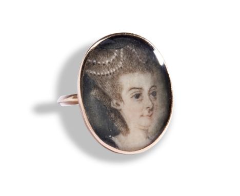 A GEORGIAN PORTRAIT MINIATURE RING, CIRCA 1880 depicting a lady, her hair dressed with pearls.&nbsp; Possibly The Duchess of 