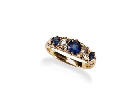 A DIAMOND AND SAPPHIRE FIVE STONE RING claw set with three mixed cut sapphires and two old cut diamonds set within a carved h