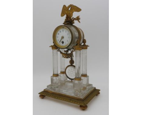 A FINE FRENCH EMPIRE GILT METAL MOUNTED CRYSTAL PORTICO CLOCK, 19th Century,&nbsp;finely acid etched with anthermons laurel w