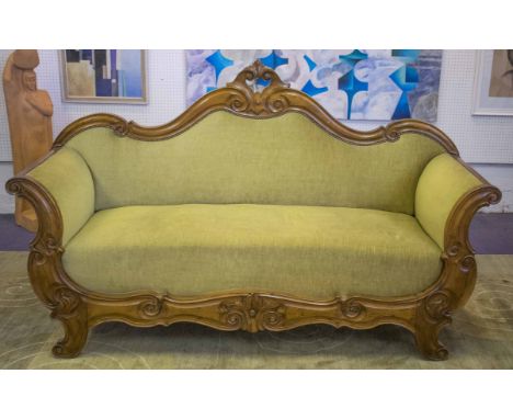 SOFA, mid 19th century Italian walnut with scrolling frame upholstered in green velour, 178cm W.