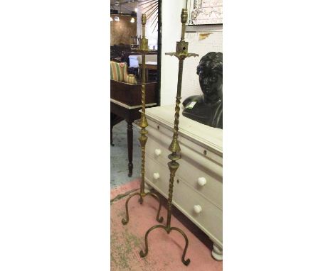 STANDARD LAMPS, a pair, 1950s Italian brass on tripod supports, 142cm H. (2)