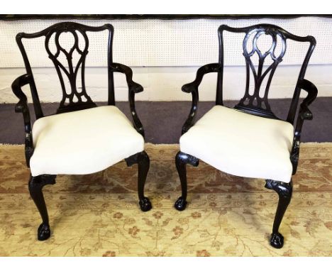 OPEN ARMCHAIRS, a pair, George III, Chippendale style, circa 1780, mahogany, finely carved with foliate decoration in calico 