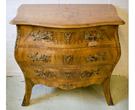 BOMBE COMMODE, late 19th century Swedish walnut with three drawers and decorative gilt metal handles on cabriole supports, 83