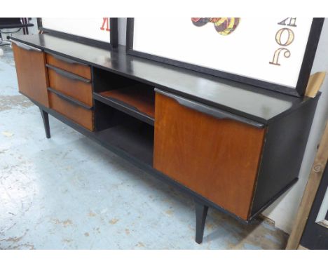 SIDEBOARD, 1960s teak with cabinet doors, three drawers and open sliding shelf with ebonised top and highlights, 198cm L x 45