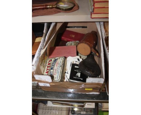 A box containing a leather shot flask, old black and white photographs, a leather cased bottle etc. 