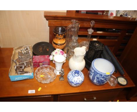 A floral encrusted ornament; a glass decanter; pottery jug; small blue and white jardiniere; and various sundries