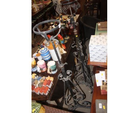 Two wrought iron oil lamp stands
