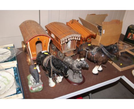 Five various model horses; and three wooden caravans 