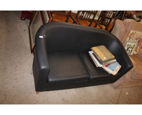 A faux leather tub shaped two seater sofa