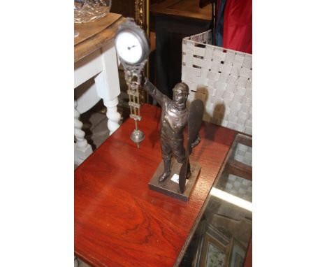 A bronzed Pilot swing type clock