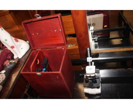 A Bresser microscope with carrying case