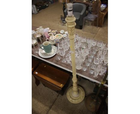 A cream painted standard lamp