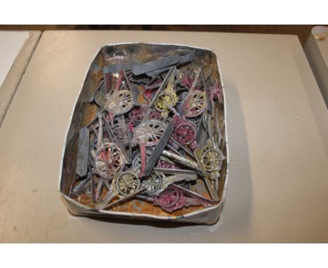 A tin of lead model cannons 
