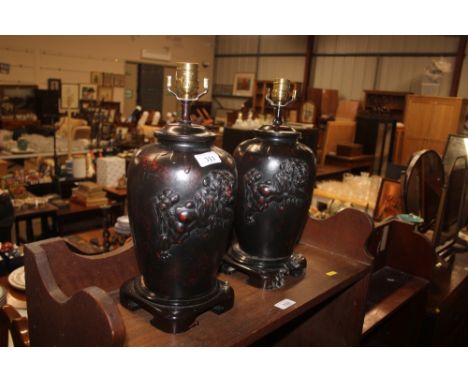 A pair of oriental bronze table lamps