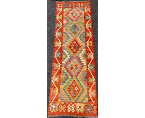 An Anatolian Kilim rug / carpet runner, 247cm x 83cm. 