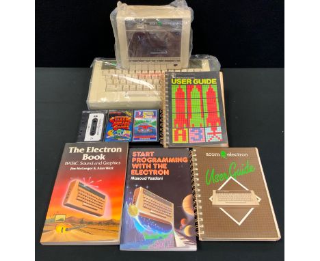 An Acorn Electron personal computer, produced from 1983, with data recorder, manuals, power packs, software and games inc Cla