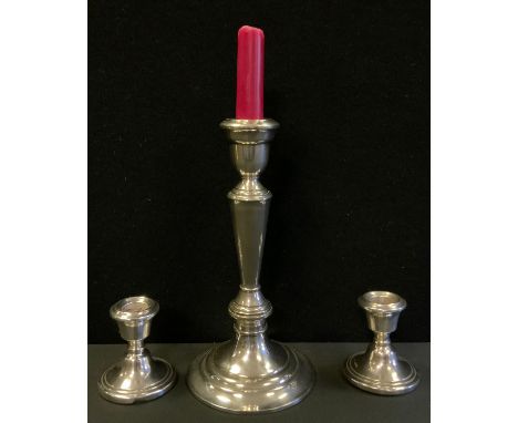 A pair of silver squat candlesticks, weighted bases, Birmingham 1975, 198g gross;  a Gorham Heritage alter candlestick, 22cm 