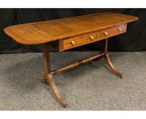 A late 19th century regency style mahogany sofa table, rectangular top, with D-shaped drop ends, pair of drawers to frieze, m